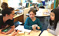 A photograph of a student using the hand-crank generator.
