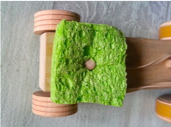 Photo of a toy car with a sponge attached to cause wheel friction.